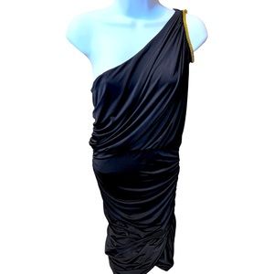 Fredricks black stretch cold shoulder fitted dress with gold bead accents.
